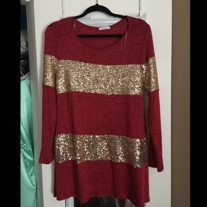 Gold and red stripped shirt.